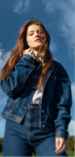 Young woman in denim jacket outdoors